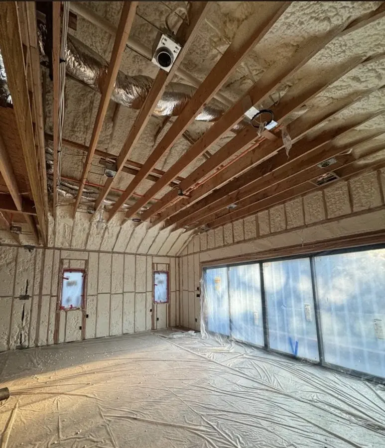 Interior walls and ceiling insulated with spray foam during new construction in Wilkins